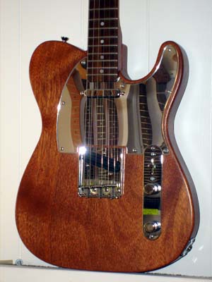 Solid Brazilian mahogany with custom mirror pick guard